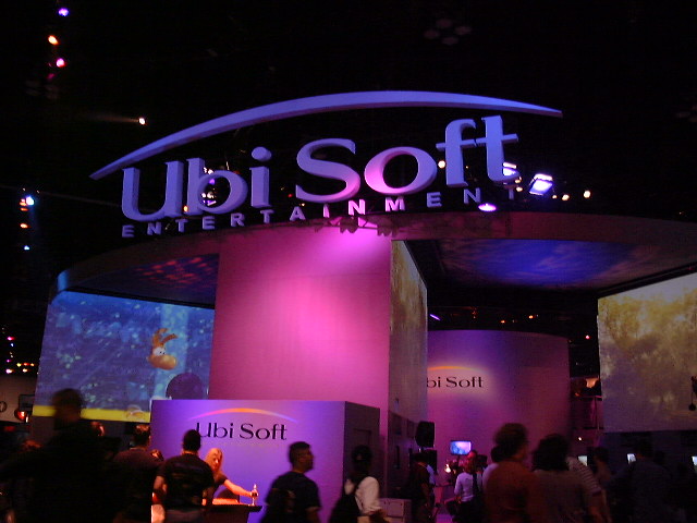 The Ubisoft Entertainment booth, glowing purple in the dark of West Hall.