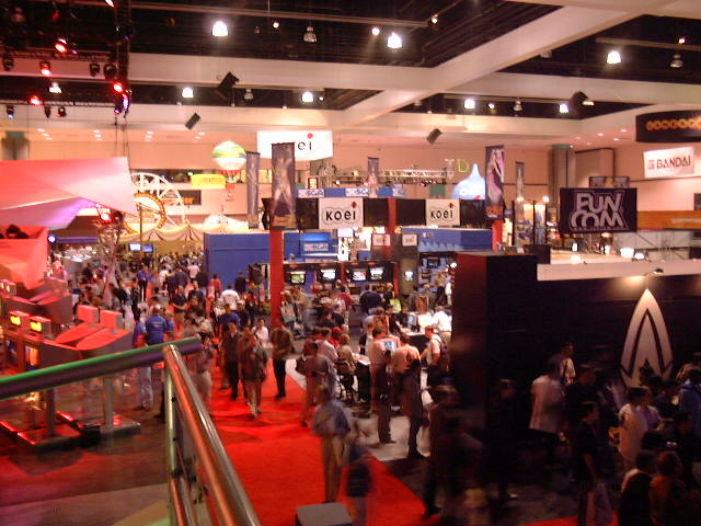 The show floor from above — Koei, Bandai, FunCom booths stretch out in every direction.