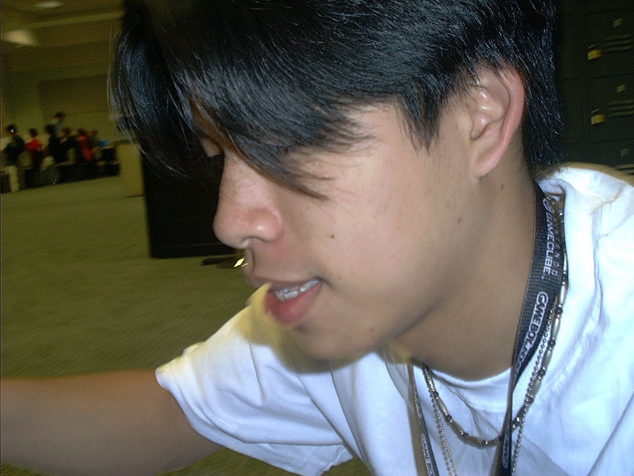 Working the GameCube press area — Colin Yu takes a break.