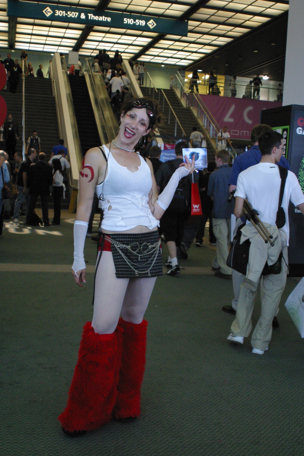 A cosplayer on the show floor posing for photos — costumes were everywhere at E3.
