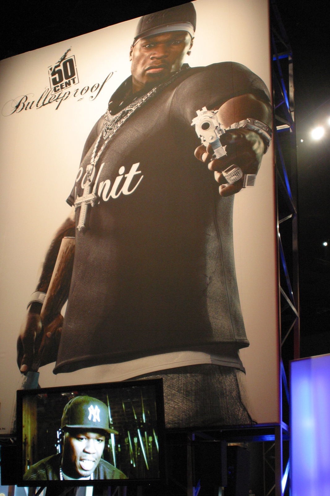 A massive 50 Cent: Bulletproof banner looming over the show floor.