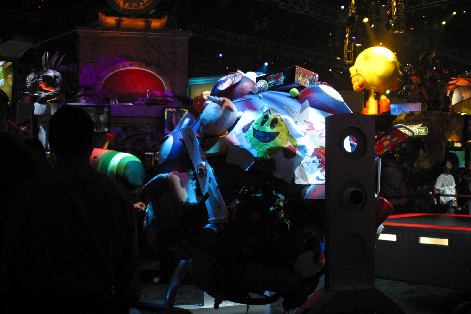 A colorful booth display with giant inflatable characters — the show floor was sensory overload.