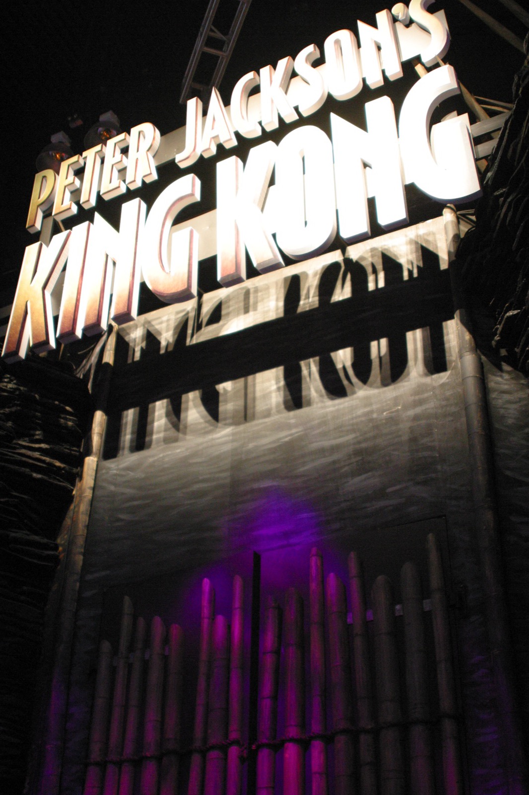 The Peter Jackson's King Kong booth — a towering sign with dramatic backlighting and fog effects.