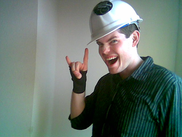 Aaron poses with the Steel Lounge gear. Gaming gloves and hard hats...